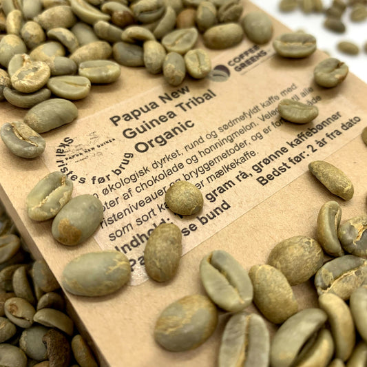 Papua New Guinea Tribal Organic - Raw, green coffee beans.